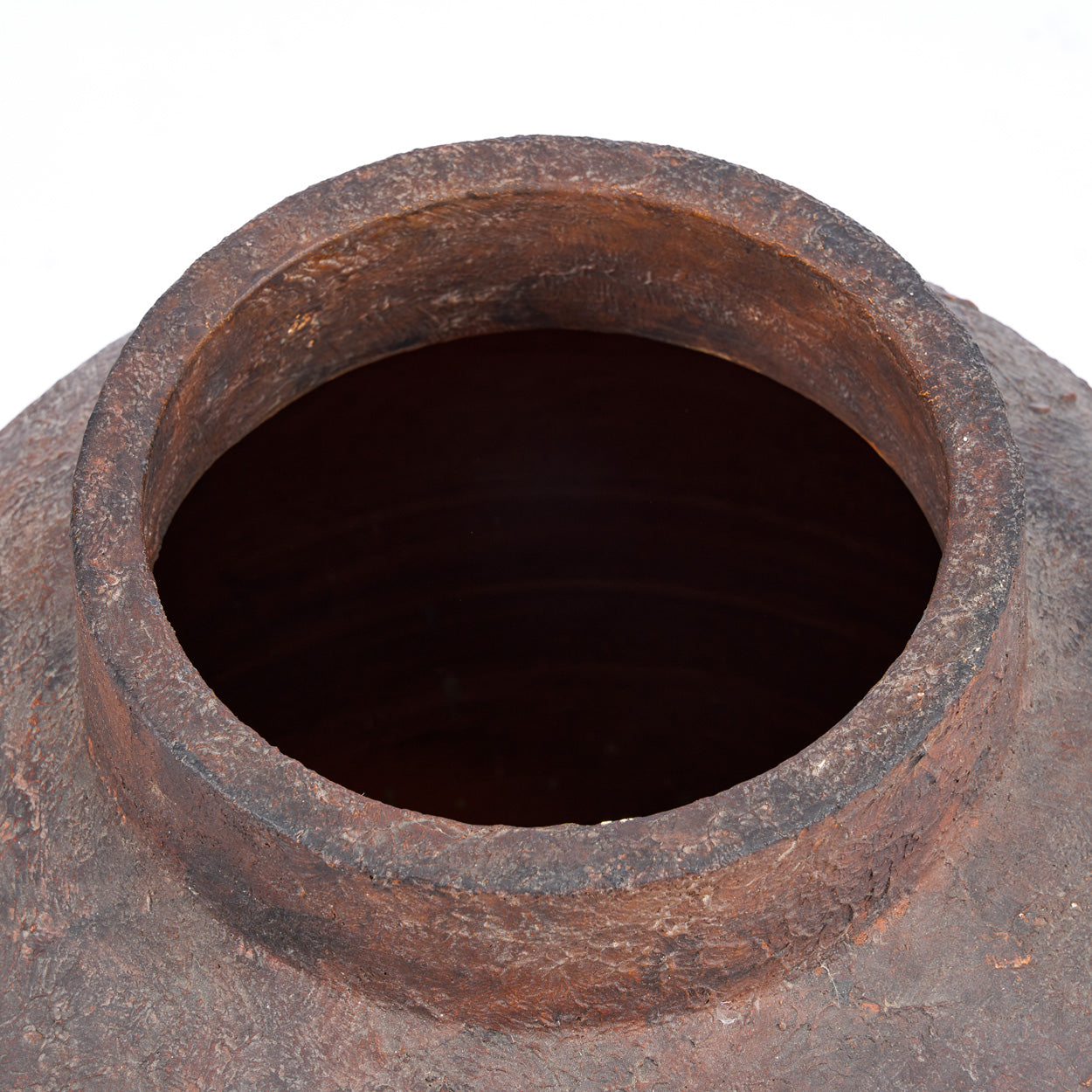 Close-up of a terracotta vase on a white background