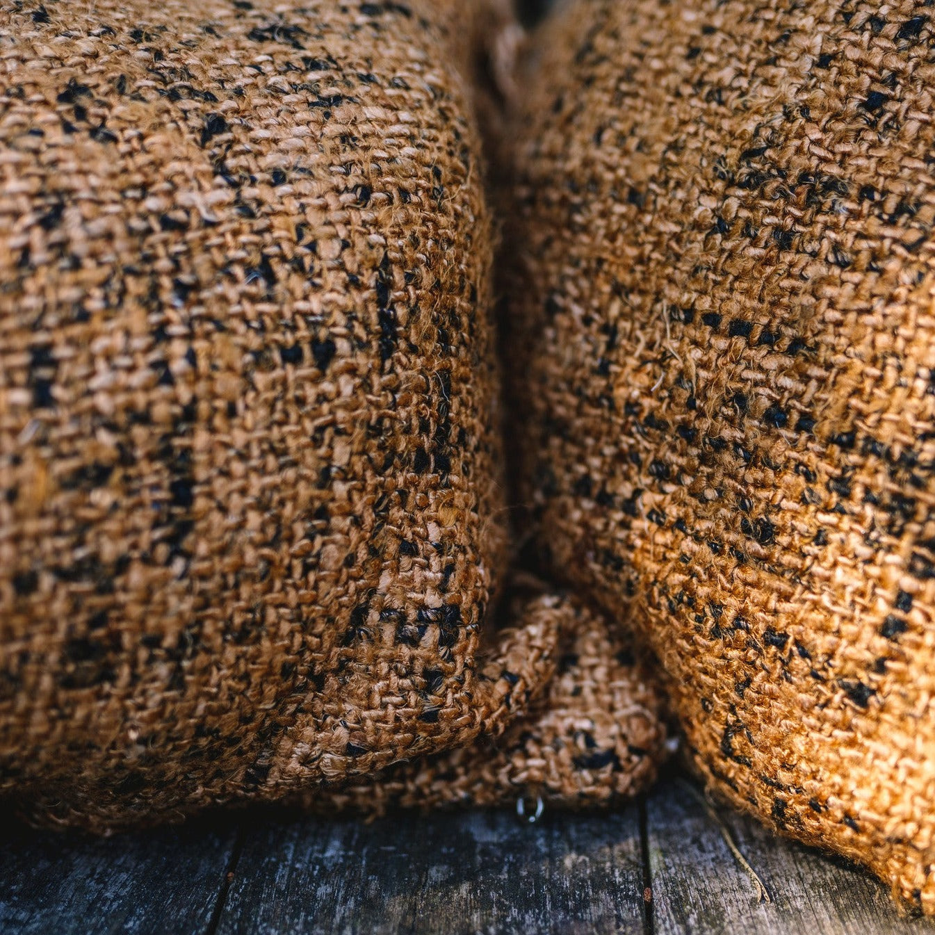OH MY GEE Cushion Cover Cinnamon Black macro view of two cushions