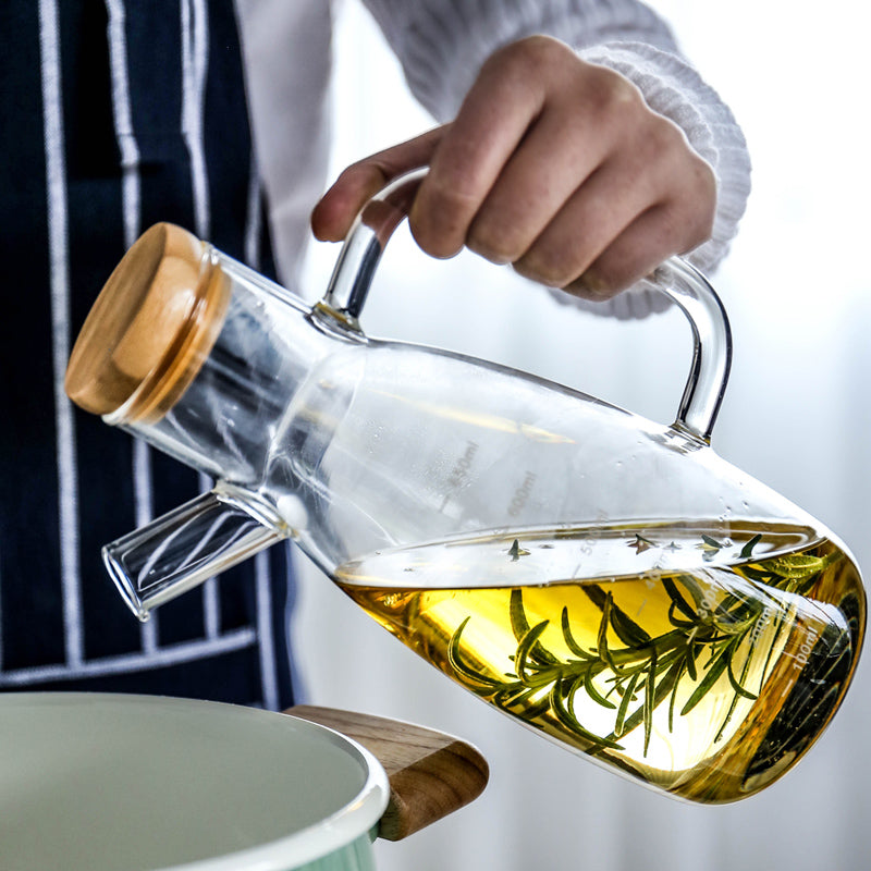 Bouteille d'huile en verre transparent avec poignée