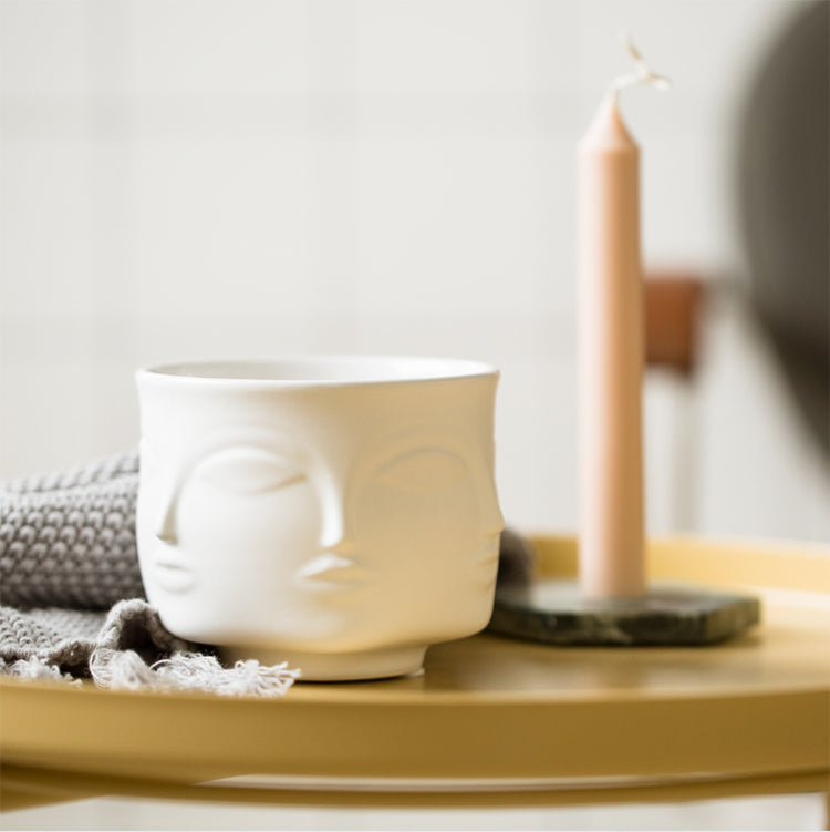 Pot de fleurs en céramique avec visage en style nordique