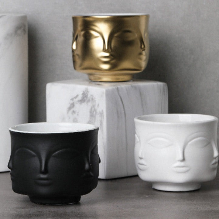 Pot de fleurs en céramique avec visage en style nordique