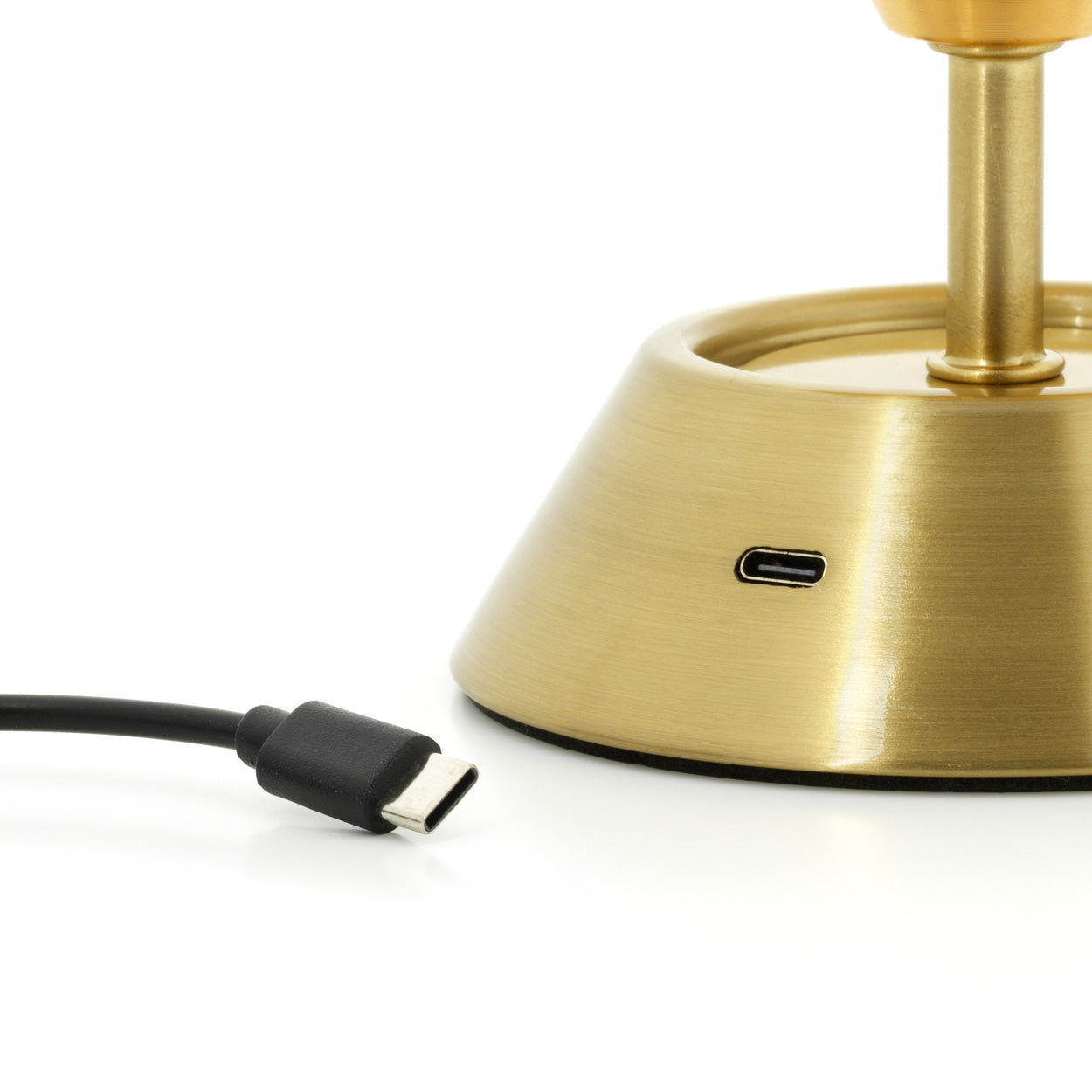 Gold table lamp with USB Type-C cable on a white background