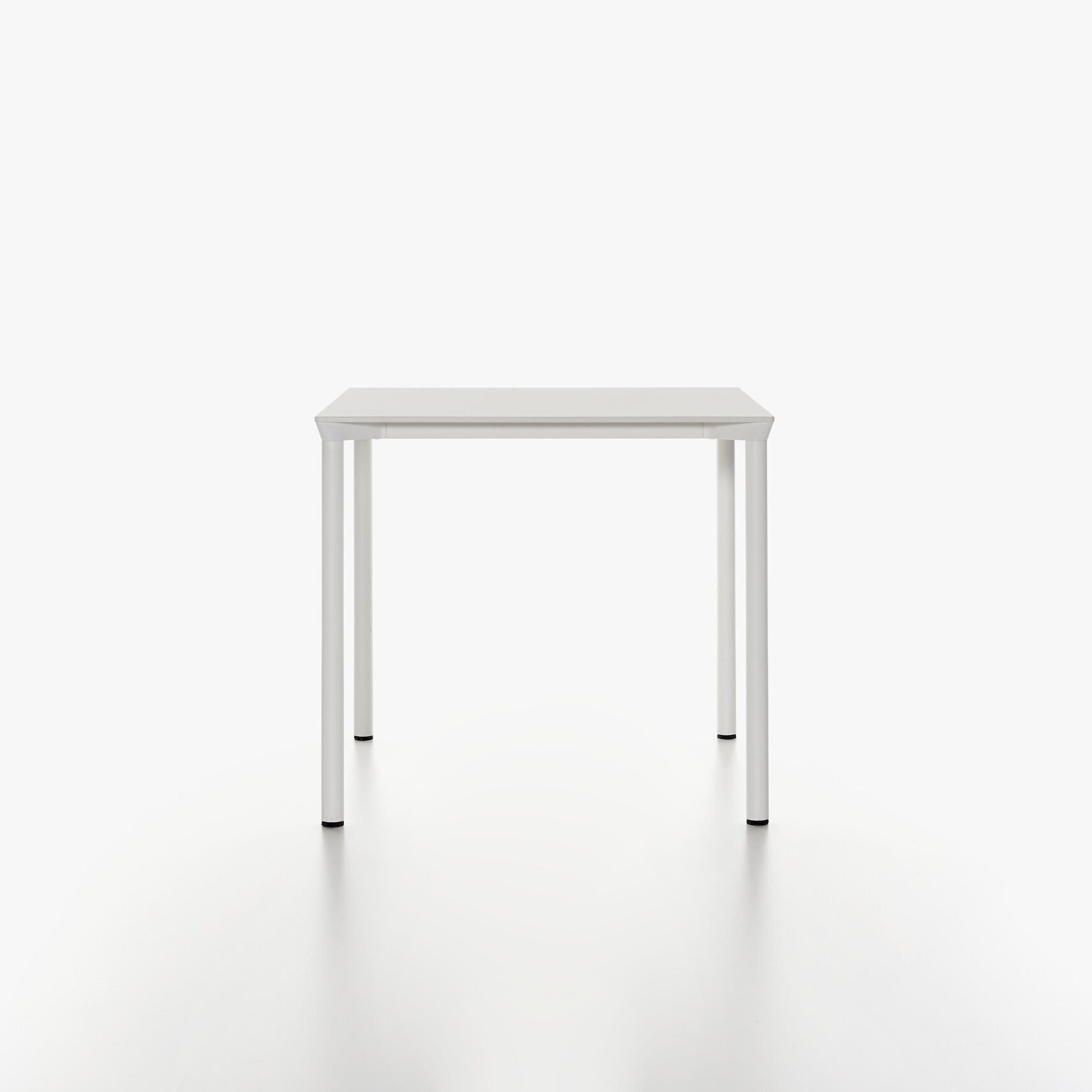 MONZA square table with white HPL table top and white powder coated legs on a white background