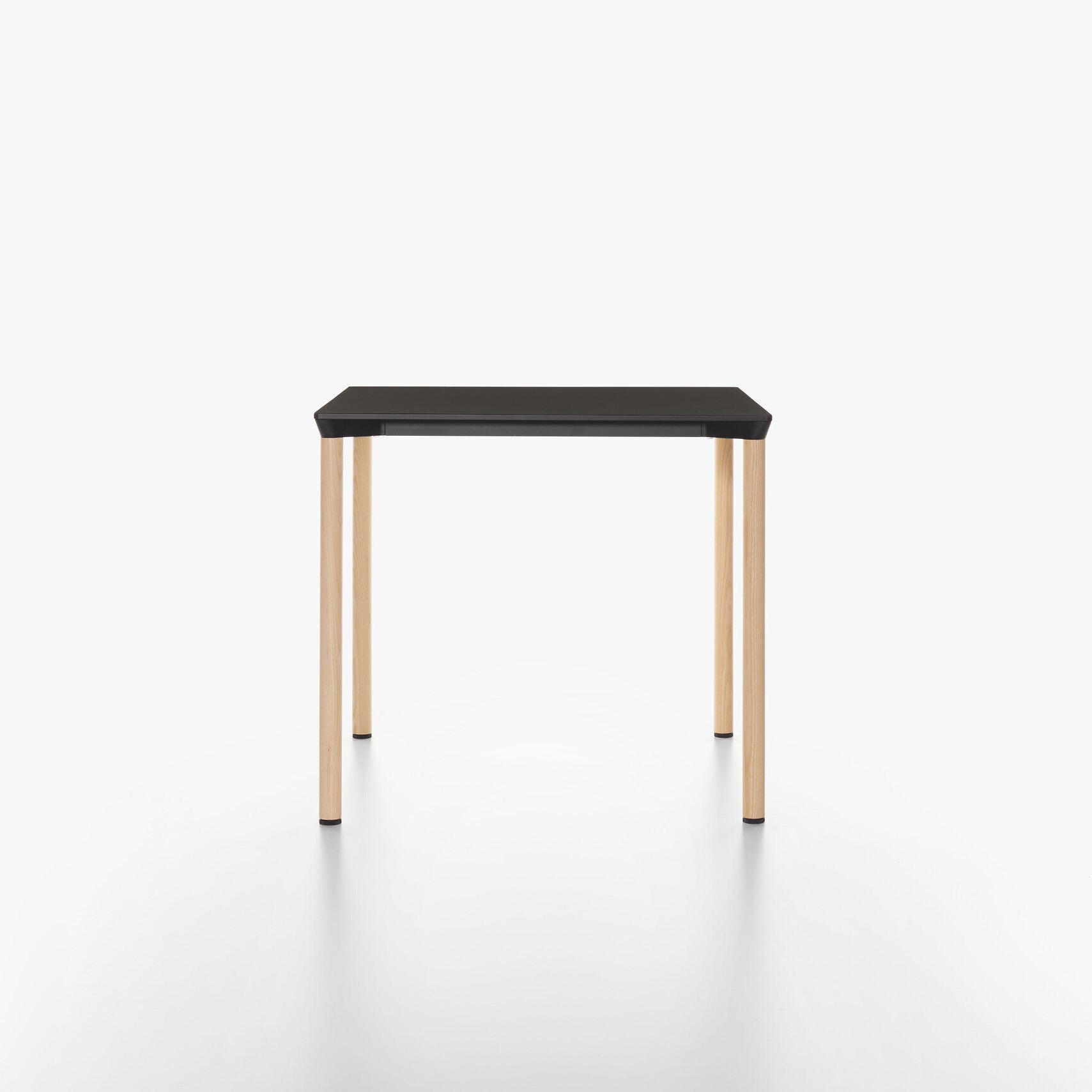 MONZA square table with black HPL table top and ash natural lacquered legs on a white background