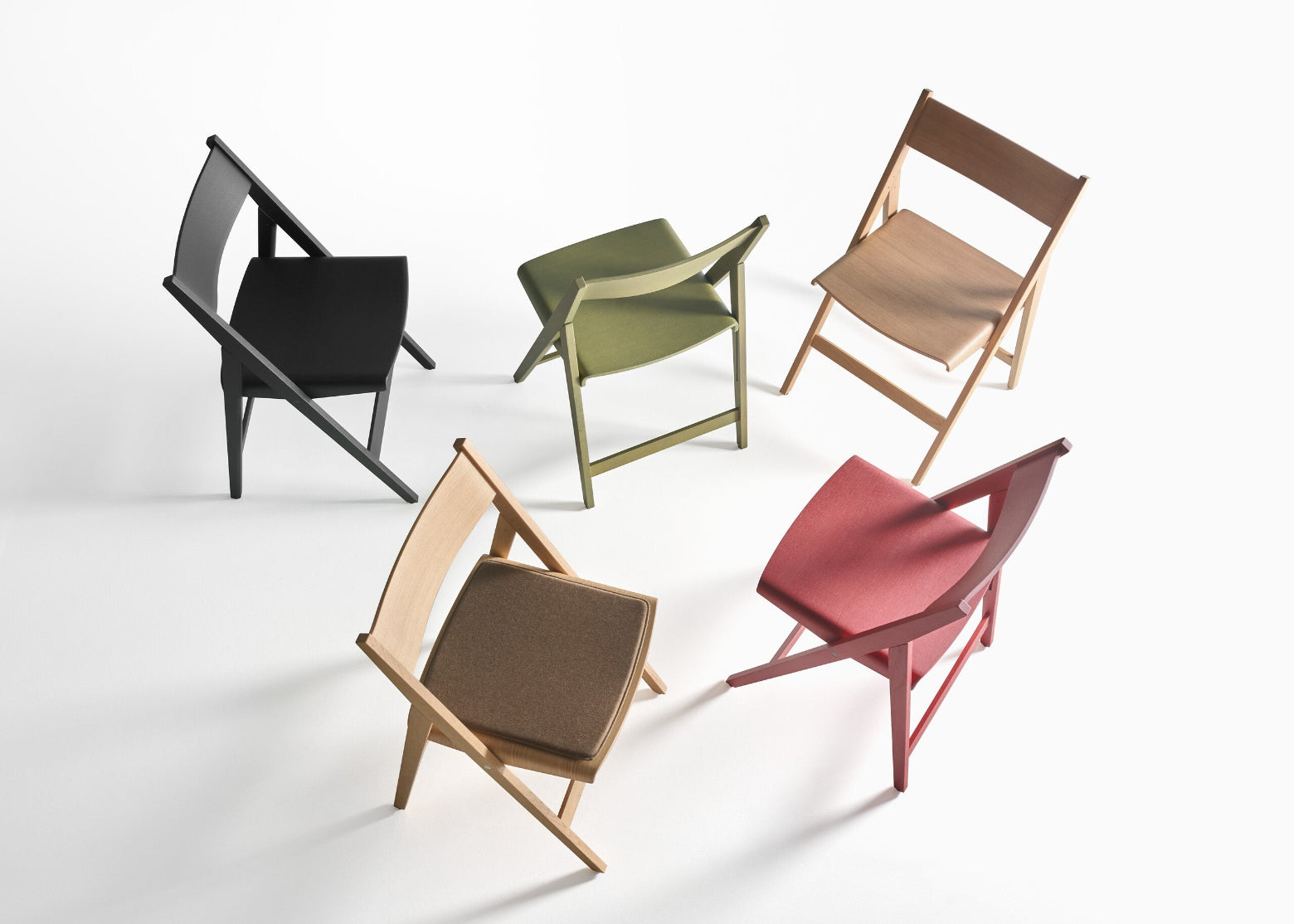 Five colorful THEO chairs on a white background