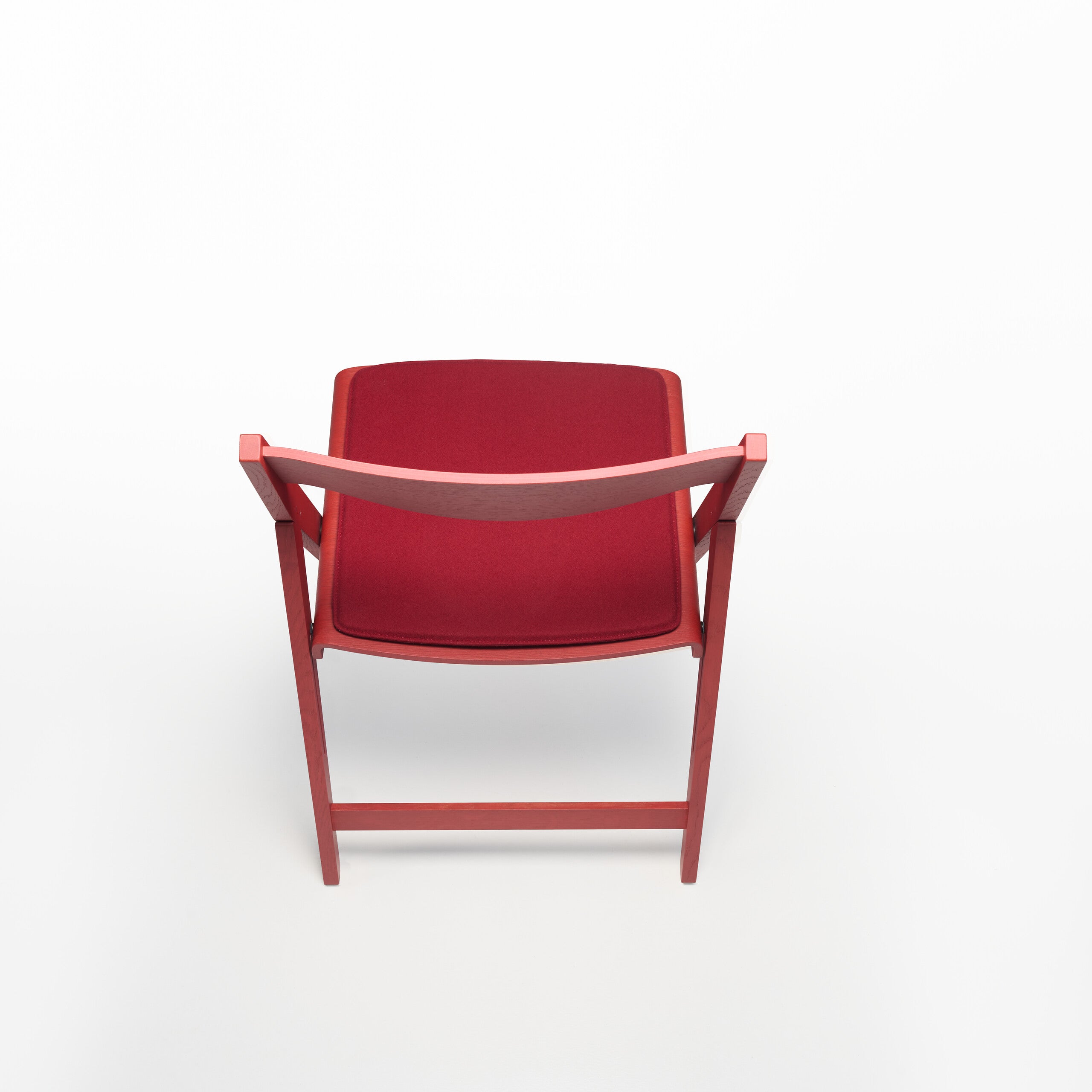 Red THEO chair with soft part on a white background