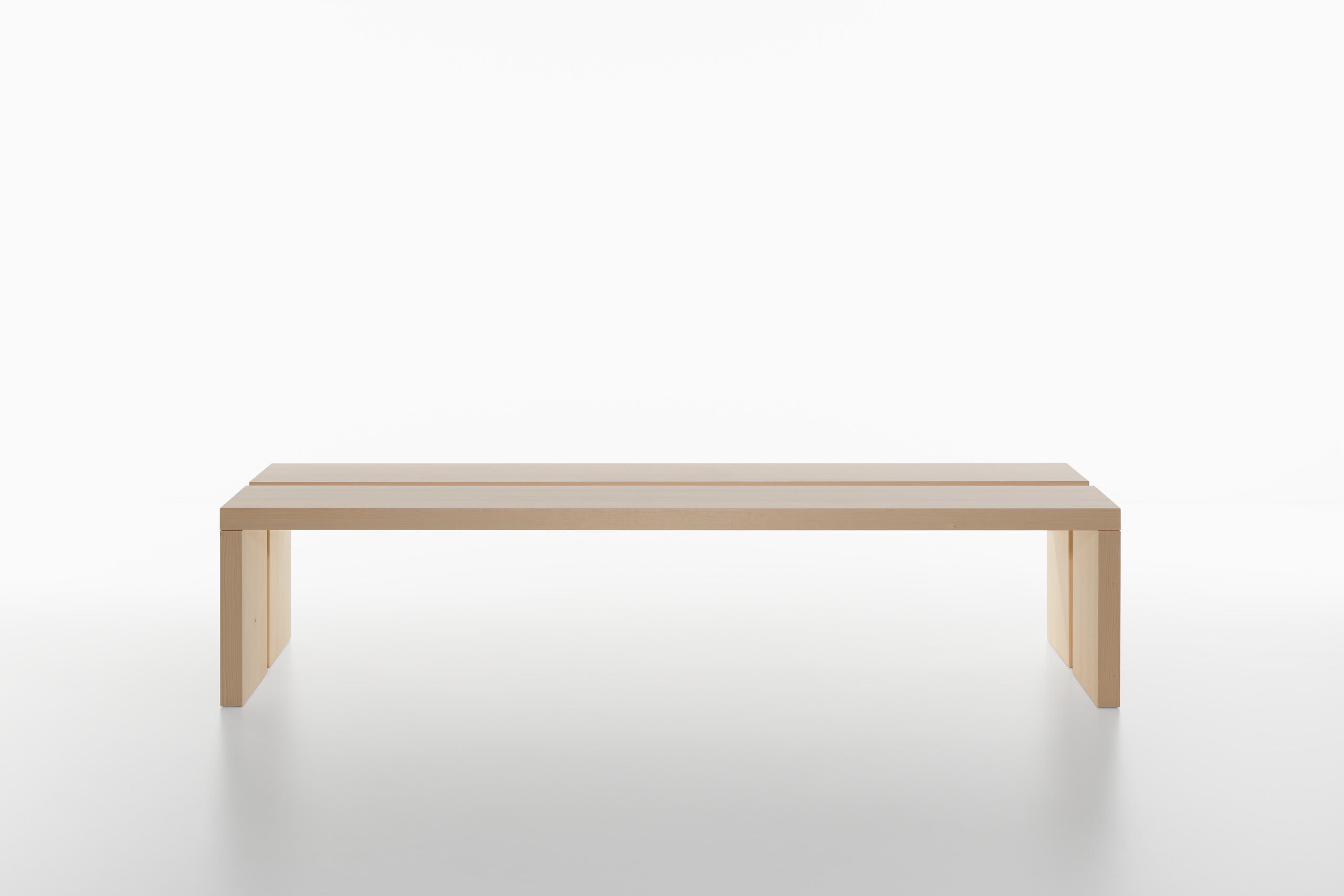 Two wooden benches on a white background