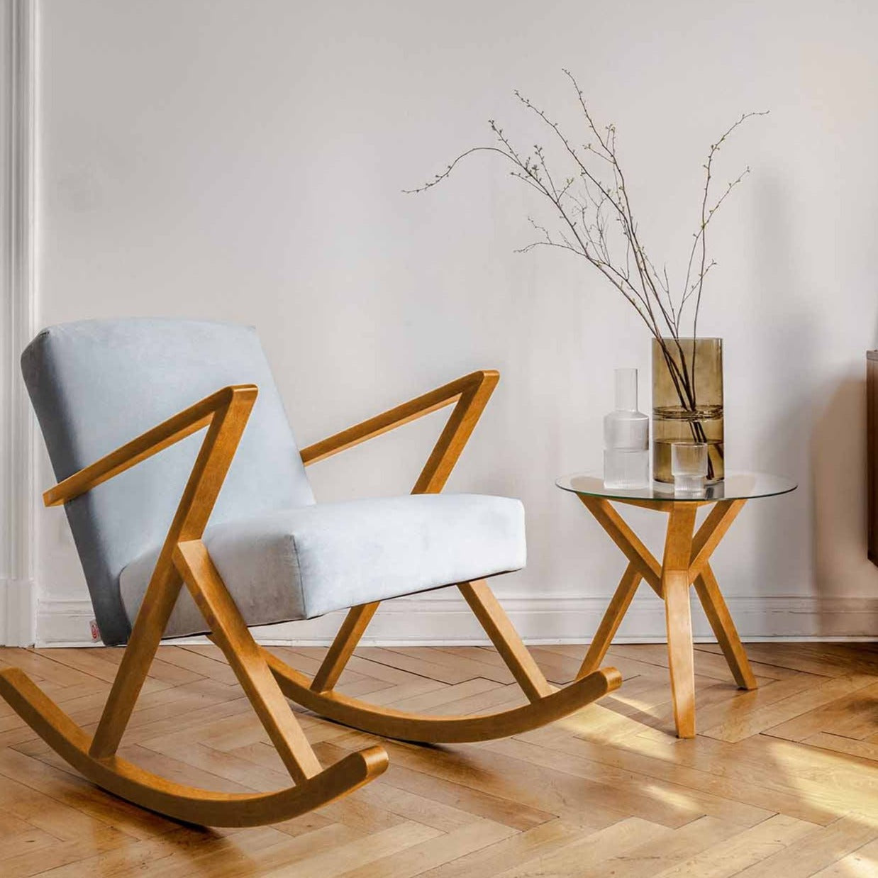 Side Table, Beech Wood Frame, Oak Colour interior view with rocking chair with white upholstery and oak colour frame at vase at the top of table