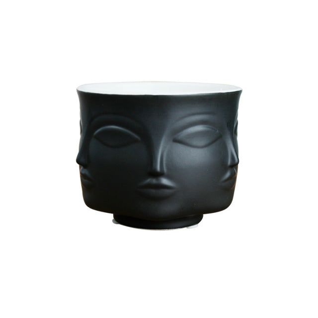 Pot de fleurs en céramique avec visage en style nordique